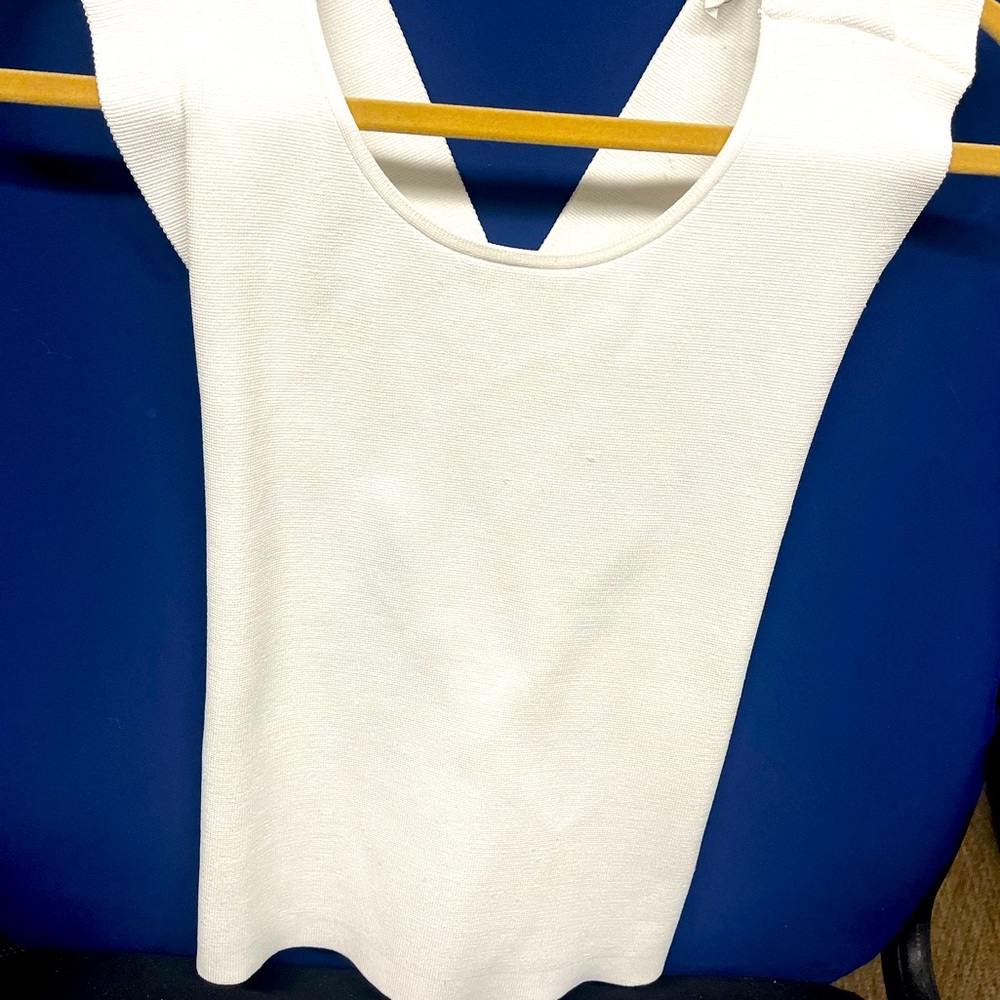 A.L.C. size med. thick white top, w/criss cross backing & high neck in front.